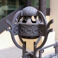 Closeup shot f a wrought iron bike rack in the historic center of Asti