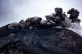 Closeup shot of the famous Etna volcano smoky and ashy top under a cloudy sky in Sicily, Italy Royalty Free Stock Photo