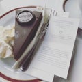 Closeup shot of the famous Sacher Cake and a menu in Vienna, Austria