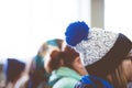 Closeup shot of a female with glasses wearing a beany with a blurred background Royalty Free Stock Photo