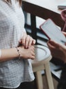 Closeup shot of a female wearing a fashionable bracelet with charm pendants Royalty Free Stock Photo