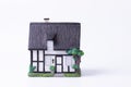 Closeup shot of a figurine house isolated on a white background
