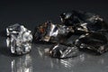 Closeup shot of fine gallium stones isolated on dark background