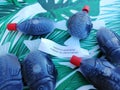 Closeup shot of fish-shaped bottles with soy sauce and a sheet of paper Royalty Free Stock Photo