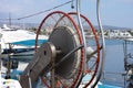 A closeup shot of a fishing boat net winch on a boat which is standing at a port Royalty Free Stock Photo