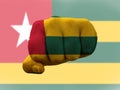 Closeup shot of a flag of Togo painted on male fist