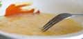 Closeup shot of a fork and beaten egg yolks for an omelet Royalty Free Stock Photo