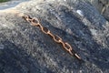 Closeup shot of a fragment of the old rusted metal chain Royalty Free Stock Photo