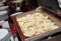 Closeup shot of fresh dumplings in a steel tray Royalty Free Stock Photo