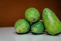 Closeup shot of fresh mangos on a brown background Royalty Free Stock Photo