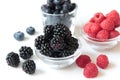 Closeup shot of fresh mixed berries on a bowl isolated on a white background Royalty Free Stock Photo
