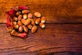 Closeup shot of fresh ripe red hazelnuts on wooden table Royalty Free Stock Photo