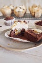 Closeup shot of the freshly baked delicious and creamy cupcake on the plate