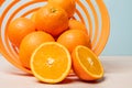 Closeup shot of freshly sliced oranges on a spiral bowl Royalty Free Stock Photo