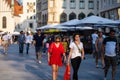 Closeup shot of friends enjoying the sunny evening together at Munich Marienplatz