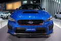 Closeup shot of the front of a blue Subaru STI at the LA Auto Show