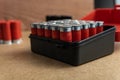 Closeup shot of a full shotgun ammo box on a brown surface