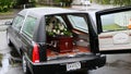 Closeup shot of a funeral casket in a hearse or chapel or burial at cemetery