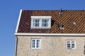 Closeup shot of a gable house under a blue sky in Holland