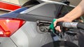 Closeup shot of a gas pump refueling the car