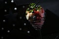 Closeup shot of a glass of chocolate dessert with different berries and fruits