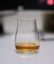 Closeup shot of a glass of cognac on the table