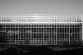 Closeup shot of glass green house in black and white