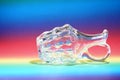 Closeup shot of a glass jug on a colorful background Royalty Free Stock Photo