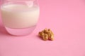 Closeup shot of a glass of walnut milk isolated on a white background