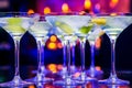 Closeup shot of glasses of cocktail with lime in a bar