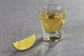 Closeup shot of gold tequila with lime slice. Diagonal sharpness. Royalty Free Stock Photo