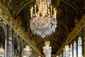 Closeup shot of golden ceiling and crystal chandeliers in the Palace of Versailles in France