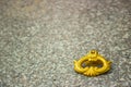 Closeup shot of a golden handle of a stone grave on stone marble