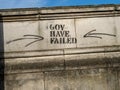 Closeup shot of a "Gov have failed" graffiti on a street building