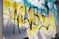 Closeup shot of graffiti painted on glass in Vienna, Austria