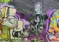 Closeup shot of a graffiti robot and its dog on legal graffiti wall, Lisbon, Portugal