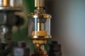 Closeup shot of a gravity feed oiler on a blurred background