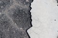 Closeup shot of a gray floor with a cracked white tile Royalty Free Stock Photo