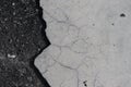 Closeup shot of a gray floor with a cracked white tile Royalty Free Stock Photo