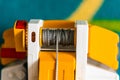 Closeup shot of gray rolled rope of a plastic toy crane