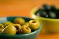 Closeup shot of green and black olives in the bowl Royalty Free Stock Photo