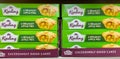 Closeup shot of green boxes of Mr. Kipling Bramley Apple Pies for sale in a UK supermarket