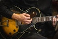 Closeup shot of a guitarist playing his guitar.