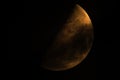 Closeup shot of a half-moon isolated on a dark sky background Royalty Free Stock Photo