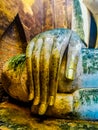 Closeup shot of the hand of Buddha statue in Wat Si Chum temple in Sukhothai, Thailand Royalty Free Stock Photo