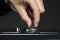 Closeup shot of a hand opening the lock of a safe