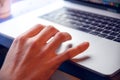 Closeup shot of a hand using the touchpad on the laptop Royalty Free Stock Photo