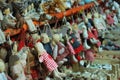 Closeup shot of handmade dolls being displayed for sale in a market Royalty Free Stock Photo