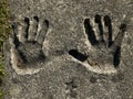Closeup shot of handprints left on the ground Royalty Free Stock Photo