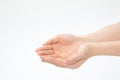 Closeup shot of hands in a begging gesture isolated on a white background